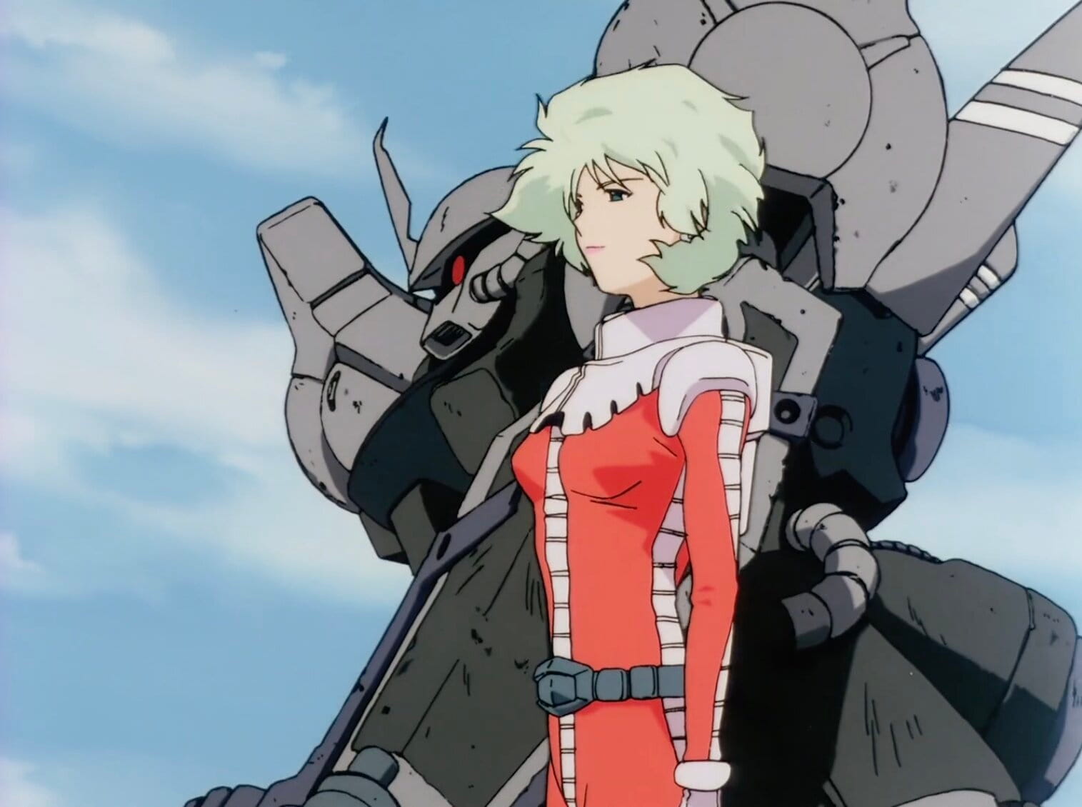 Still from Mobile Suit Gundam: The 08th MS Team with Aina standing in the foreground in a pink spacesuit with a Zaku in the background